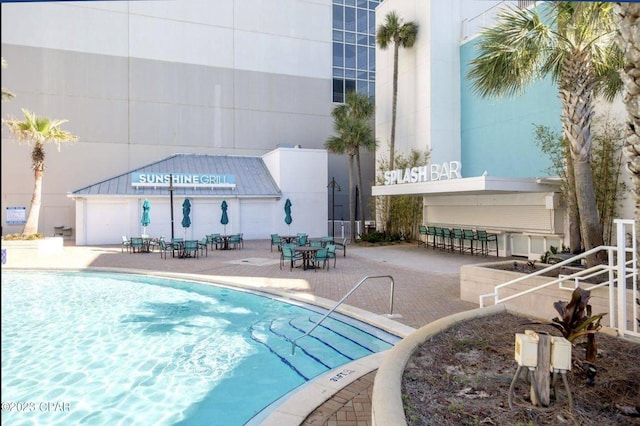 view of pool featuring a patio area