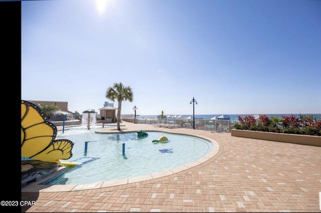 view of swimming pool featuring a patio area