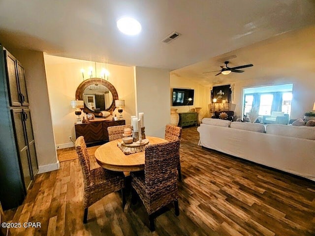 dining room with hardwood / wood-style floors and ceiling fan