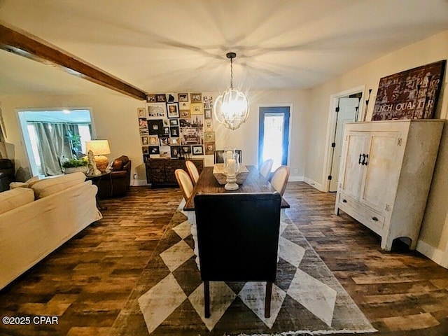 dining room with a chandelier, dark hardwood / wood-style flooring, and beamed ceiling