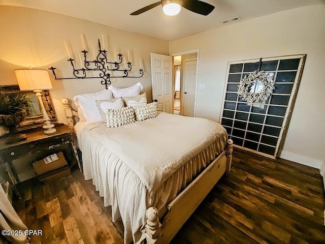 bedroom featuring ceiling fan and dark wood-type flooring