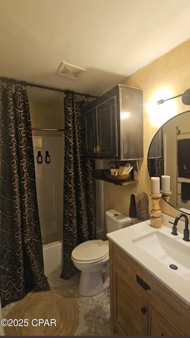 full bathroom with tile patterned flooring, shower / tub combo with curtain, vanity, and toilet