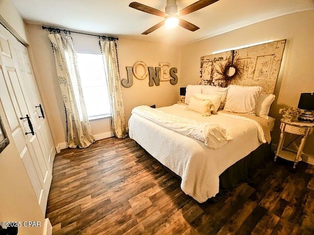 bedroom featuring dark hardwood / wood-style flooring, a closet, and ceiling fan