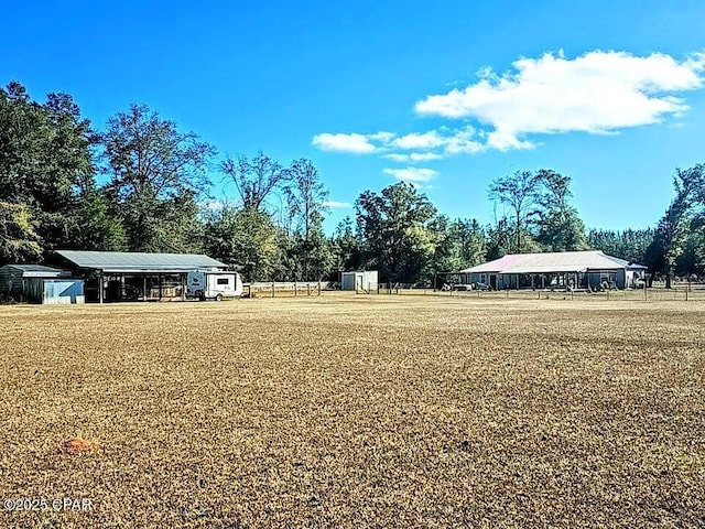 view of yard with a storage unit