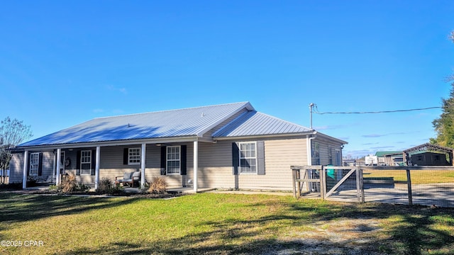 view of front of property with covered porch and a front lawn