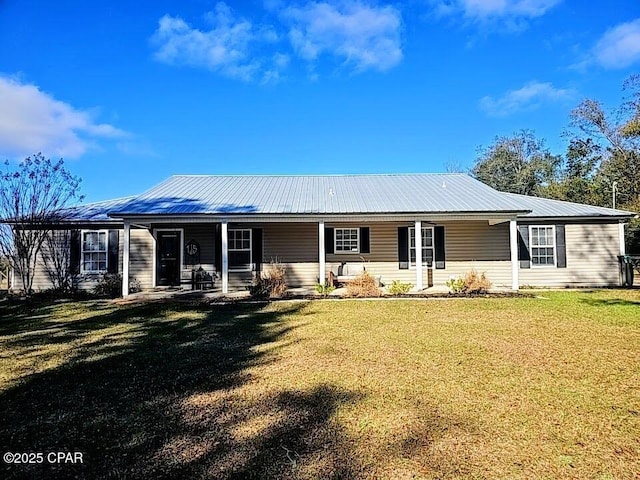 back of house with a yard