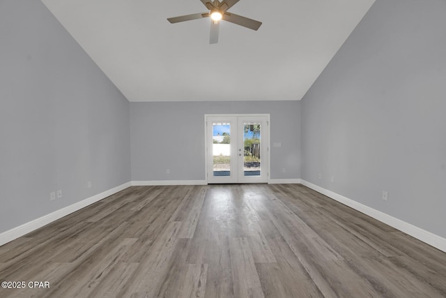 unfurnished living room with french doors, light wood-type flooring, vaulted ceiling, and ceiling fan