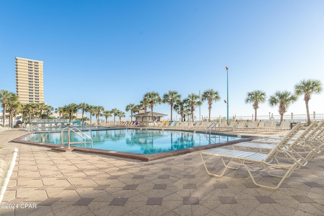 view of swimming pool featuring a patio