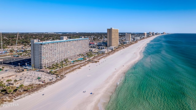 birds eye view of property with a beach view and a water view