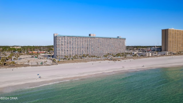 birds eye view of property featuring a view of the beach and a water view