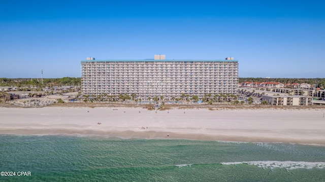 aerial view featuring a water view and a view of the beach