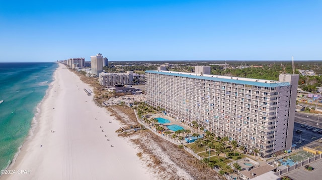 aerial view featuring a view of the beach and a water view