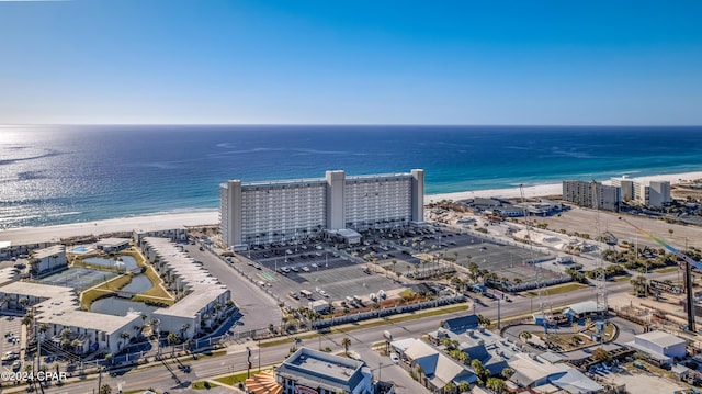 aerial view with a water view and a beach view