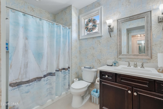 bathroom with walk in shower, vanity, and toilet