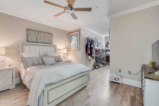 bedroom with ceiling fan, light wood-type flooring, and ornamental molding