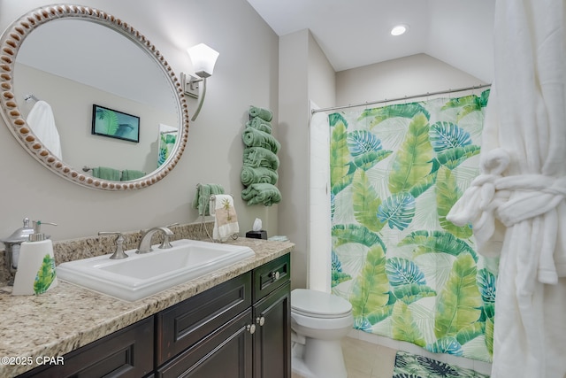 bathroom with toilet, tile patterned floors, and vanity