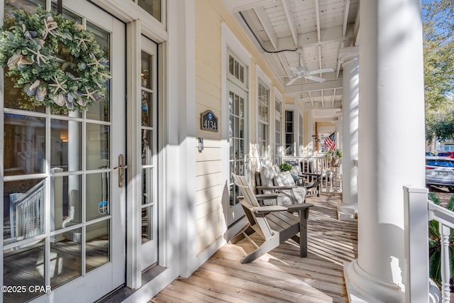 balcony featuring covered porch and ceiling fan