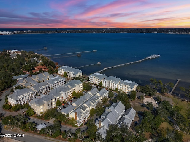 aerial view at dusk with a water view