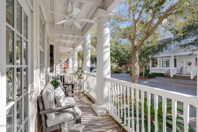 balcony with ceiling fan and a porch