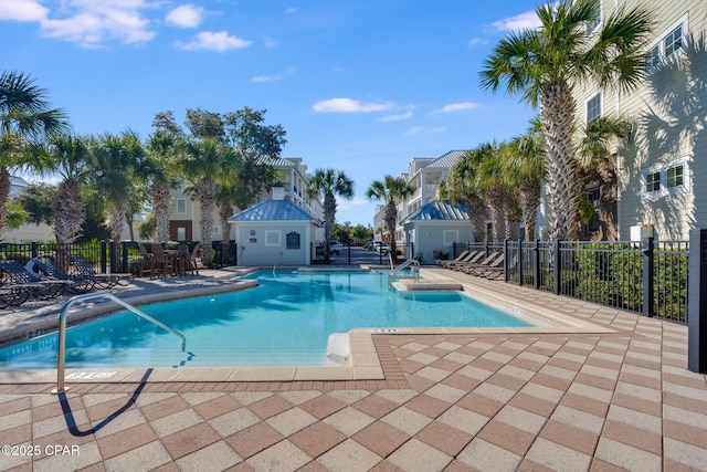 view of swimming pool featuring a patio area