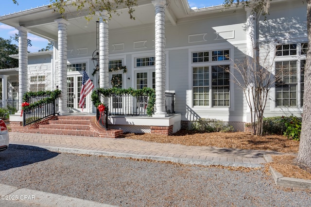 entrance to property featuring a porch