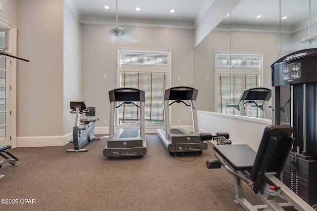 workout area featuring crown molding