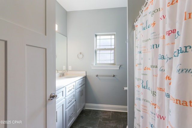 bathroom with a shower with shower curtain and vanity