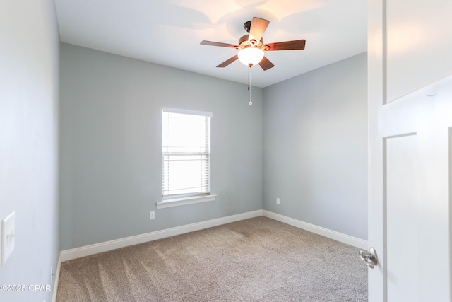 spare room with carpet and ceiling fan