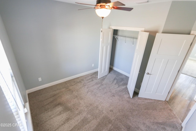 unfurnished bedroom featuring light carpet, a closet, and ceiling fan