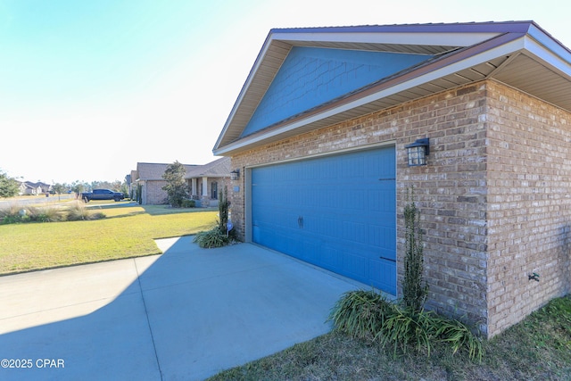 view of home's exterior with a garage and a lawn