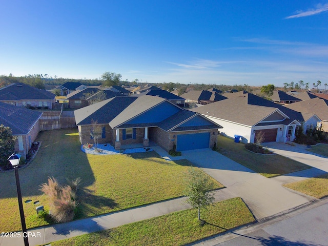 view of front of property with a garage and a front yard