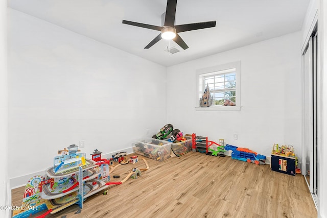 rec room featuring ceiling fan and light hardwood / wood-style flooring