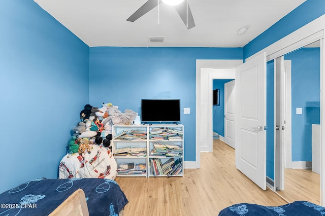 bedroom with ceiling fan and hardwood / wood-style floors