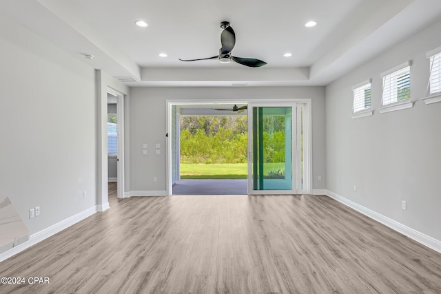 empty room featuring light hardwood / wood-style flooring and ceiling fan