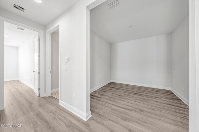 additional living space featuring light hardwood / wood-style flooring