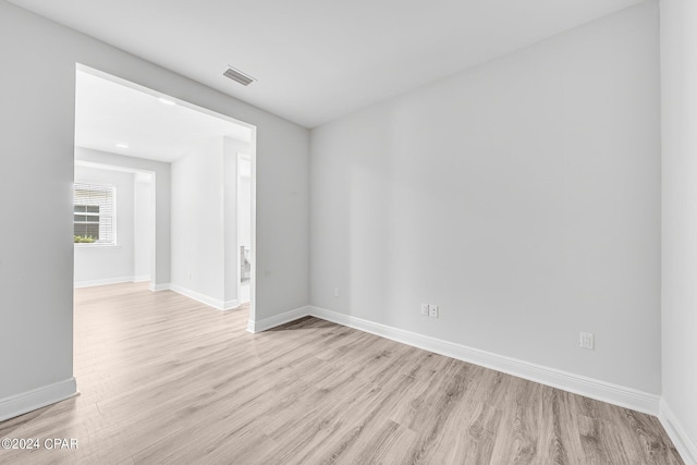 empty room with light hardwood / wood-style floors