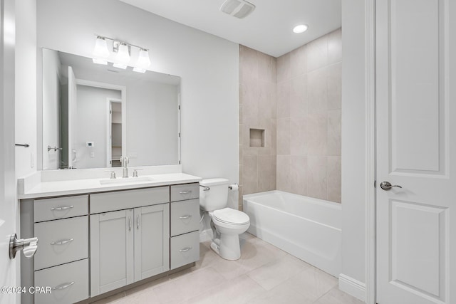 full bathroom featuring tile patterned flooring, vanity, toilet, and tiled shower / bath