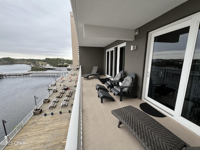 balcony featuring a water view