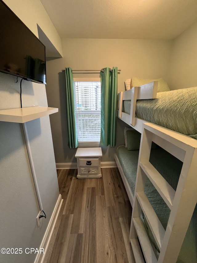 bedroom featuring dark hardwood / wood-style flooring