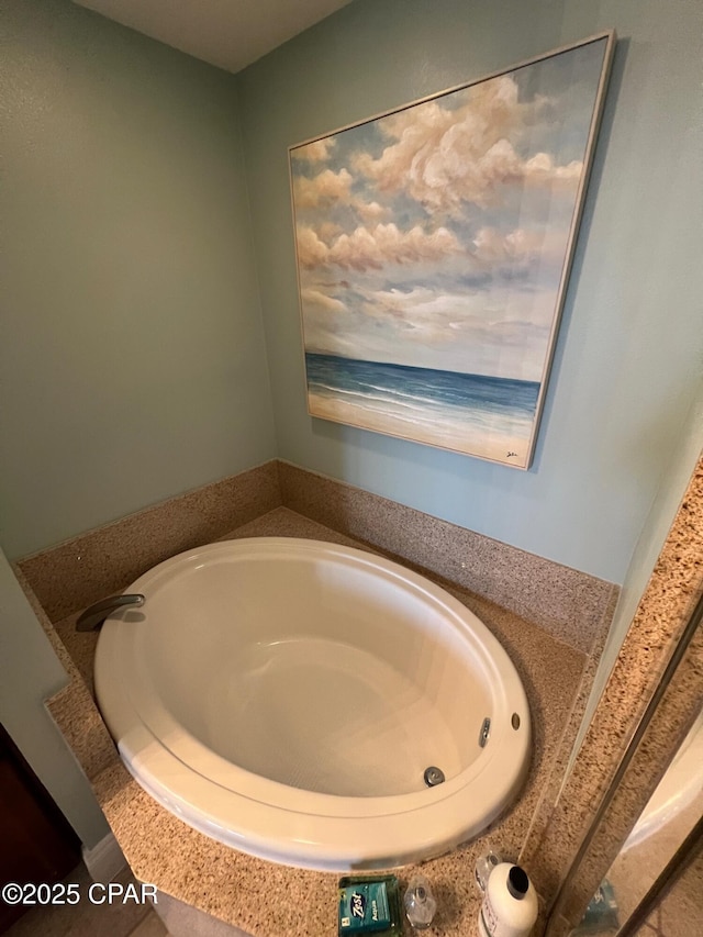 bathroom with a tub to relax in