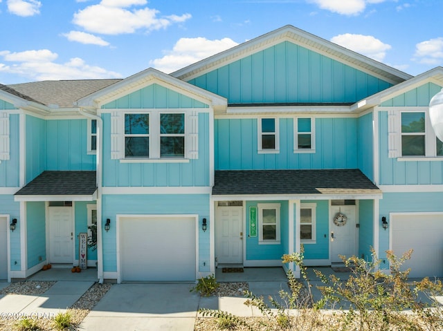 townhome / multi-family property featuring a garage