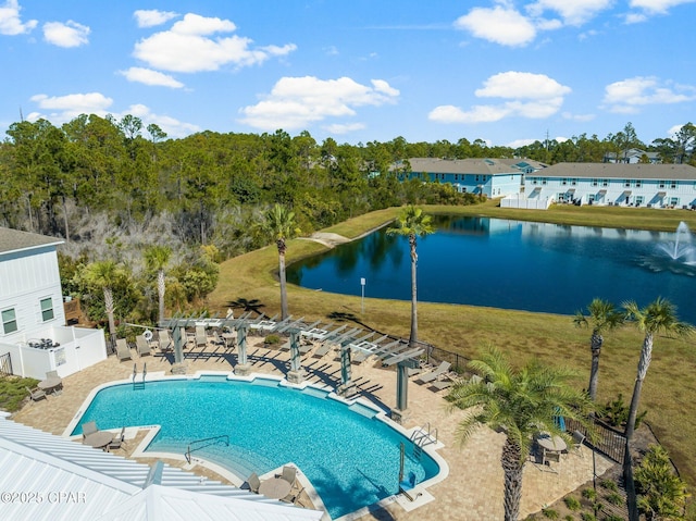 view of swimming pool with a patio and a water view