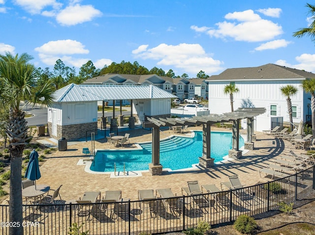 view of pool with a pergola and a patio area