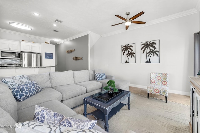 17878 Front Beach Rd Unit E2, Panama City Beach, FL 32413 - living room featuring ornamental molding, baseboards, and a ceiling fan