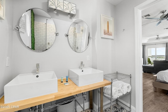 full bath featuring a ceiling fan, ensuite bath, visible vents, and a sink