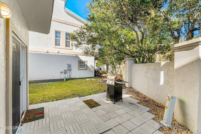 view of patio / terrace with grilling area and fence