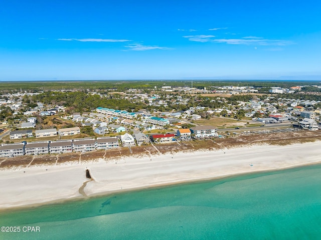 bird's eye view featuring a water view and a view of the beach