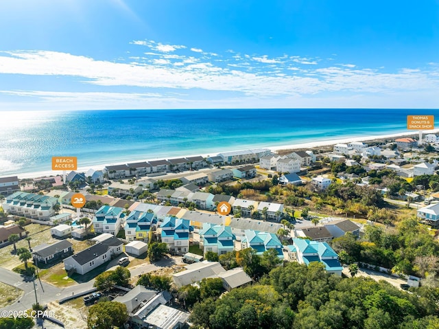 aerial view featuring a water view, a residential view, and a view of the beach