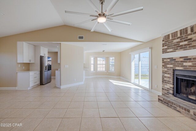 unfurnished dining area with a notable chandelier, plenty of natural light, and light tile patterned floors