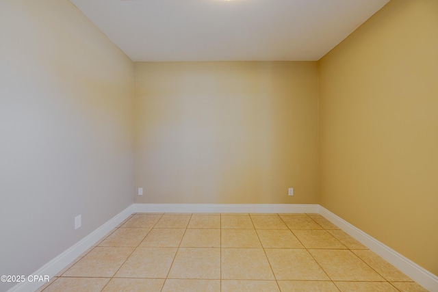 spare room with light tile patterned floors